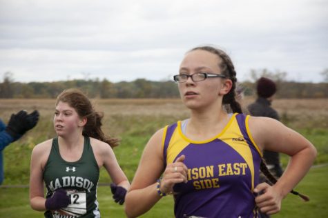 Freshman Bree Ward Debauche sprints to the finish line, determined to beat the girl next to her.