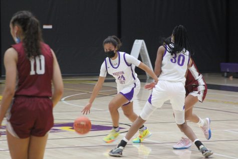 Junior Maya Griffin dribbles by with a pick from sophomore Kearra Jones in the Nov. 30 home game against La Follette.