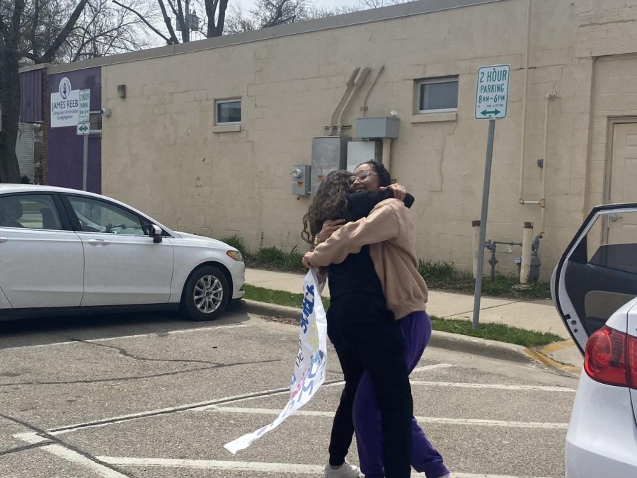 Junior Aariel Moore hugs senior Z Johnson, after accepting Johnsons promposal. “I wanted to stay “traditional” whilst making sure that it was special and custom to what we both like/what we have in common,” Johnson said.