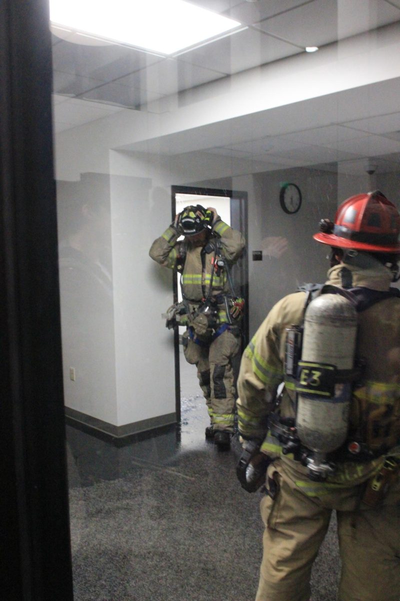 Madison firefighters walk through the school to see the extent of the flooding and to ensure the building is safe to re-enter.